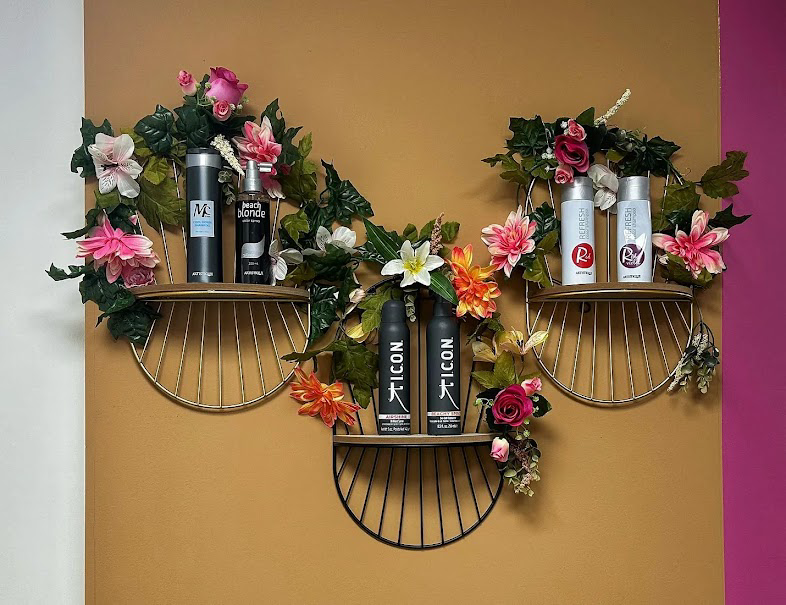 Decorative product shelf with florals and styling products