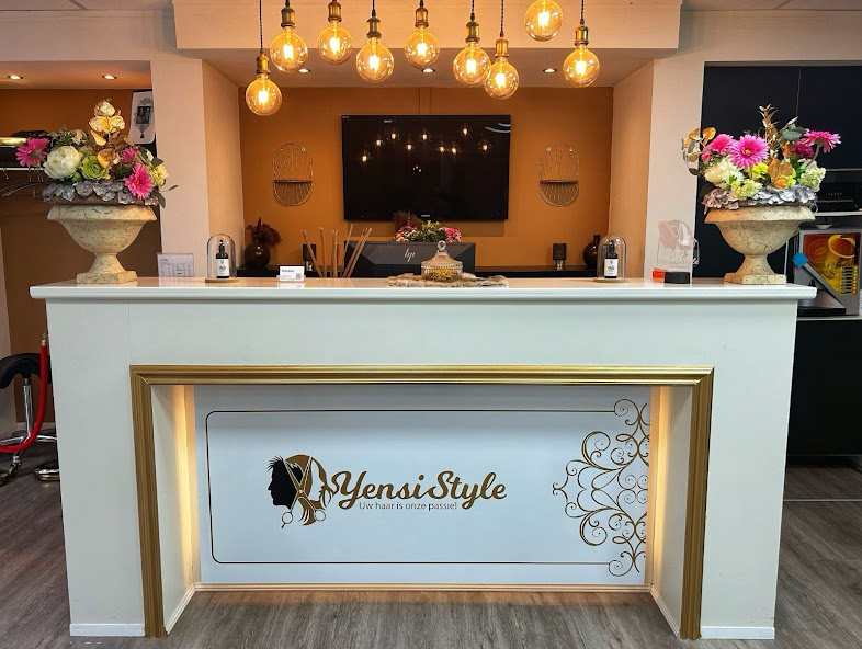 Yensi Style reception desk with signature logo and warm pendant lights